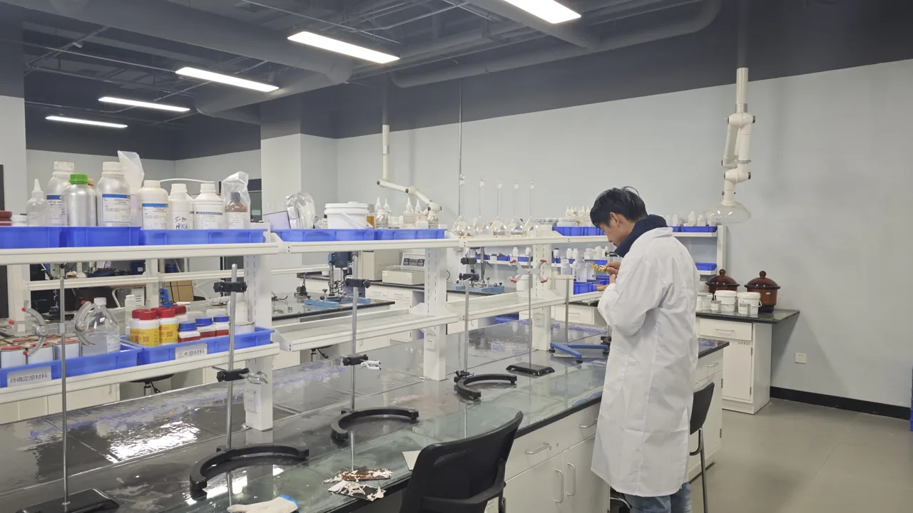 Laboratory staff working at a testing bench