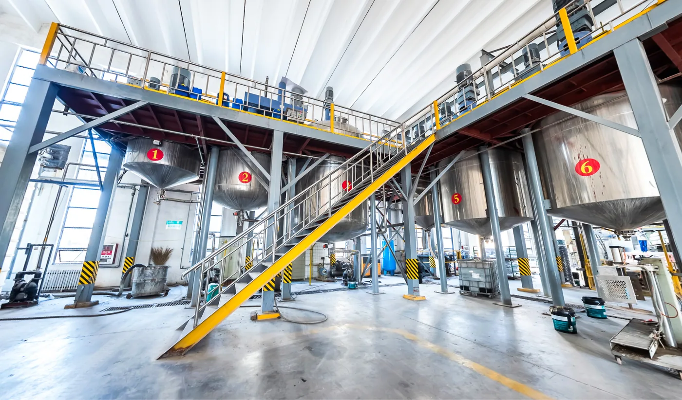 Processing vessels and access platforms in the coating workshop.