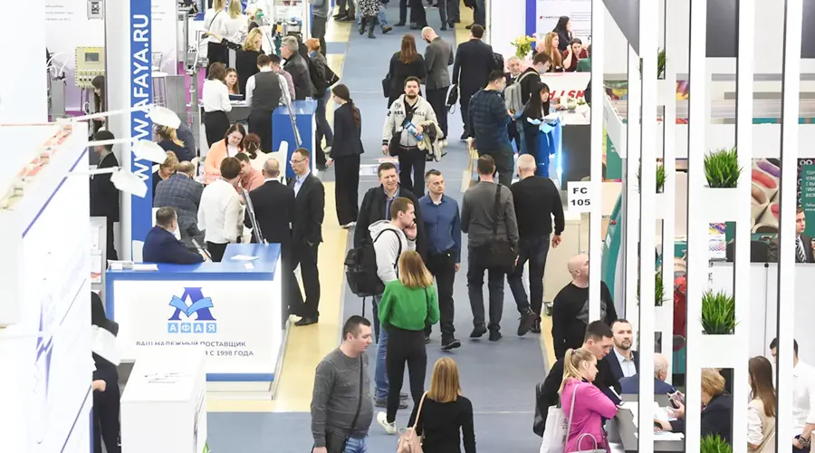 Busy exhibition floor with industrial product displays