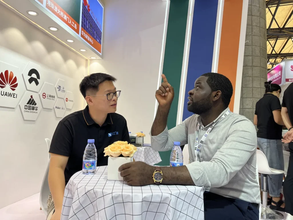 Technical discussion at a coatings exhibition