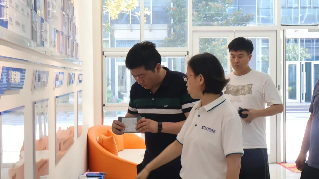 Visitors touring a coating laboratory and display area