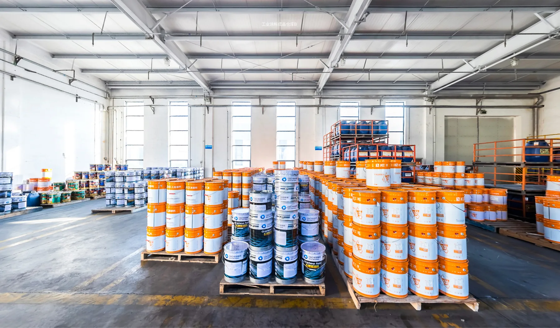 Coating containers arranged on pallets in the warehouse.